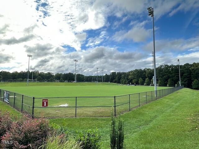 view of property's community featuring fence