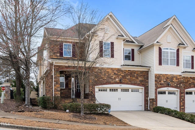 view of front of house with a garage, stone siding, and concrete driveway