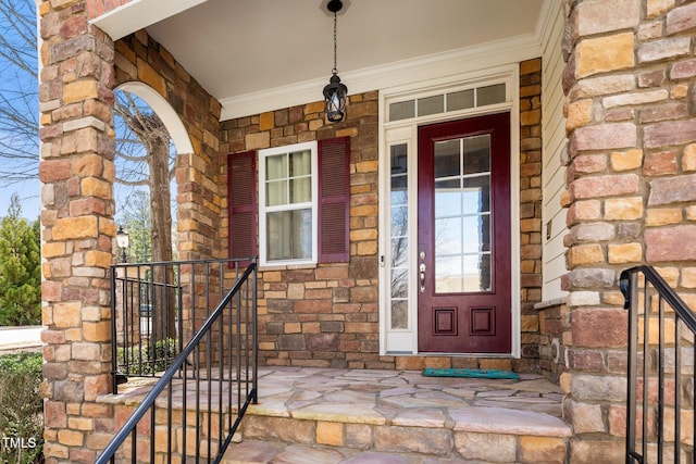 property entrance featuring a porch and stone siding