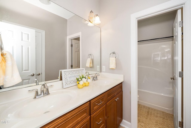 bathroom with double vanity and a sink