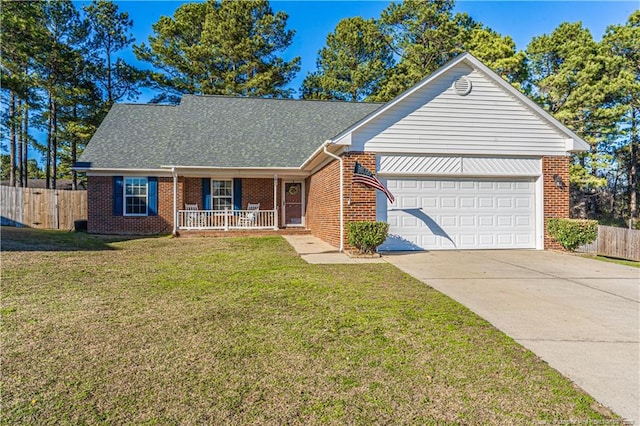 ranch-style home featuring a porch, brick siding, fence, concrete driveway, and a front yard