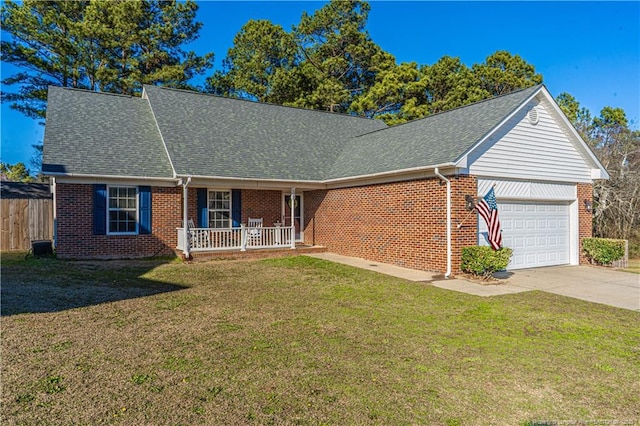 single story home with a garage, brick siding, concrete driveway, a porch, and a front yard