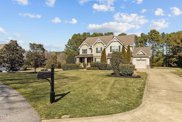 view of front of home featuring a front yard, driveway, and an attached garage