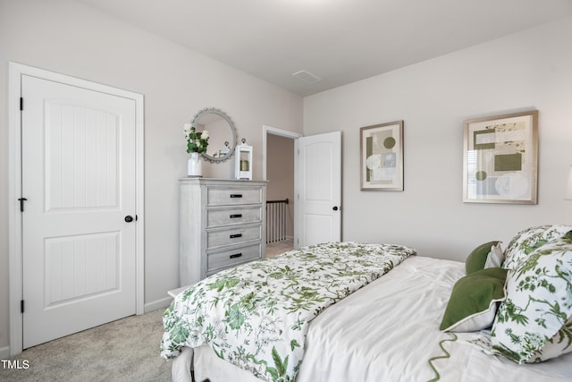 bedroom featuring carpet flooring and visible vents