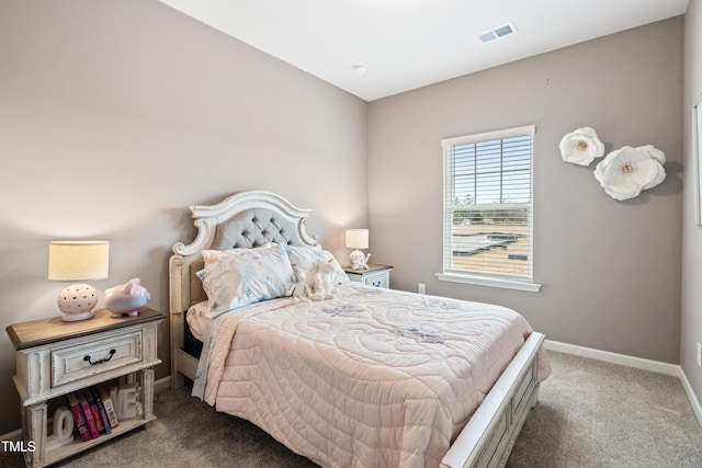 carpeted bedroom featuring visible vents and baseboards