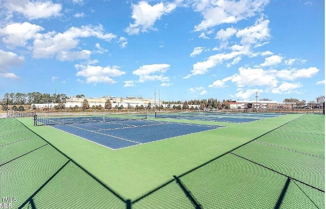 view of sport court featuring fence