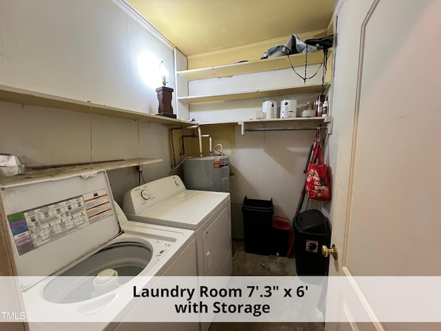 washroom with laundry area, washer and clothes dryer, and electric water heater