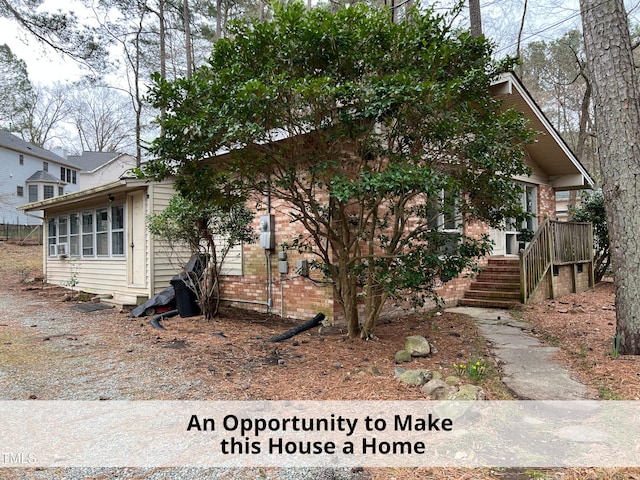 view of front of property featuring brick siding