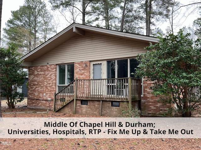 view of front of home with brick siding