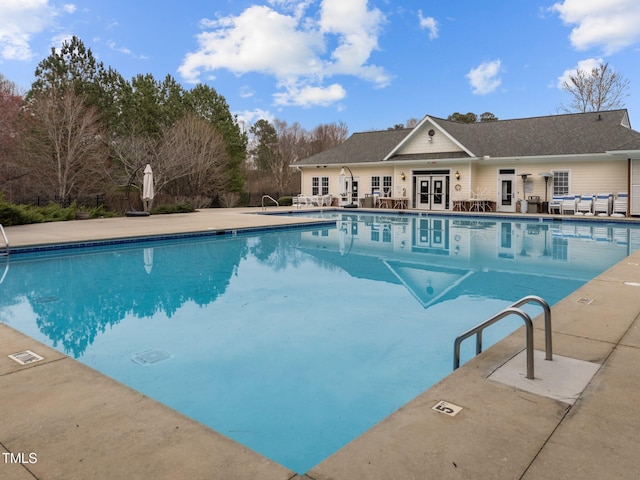 community pool featuring a patio area and french doors