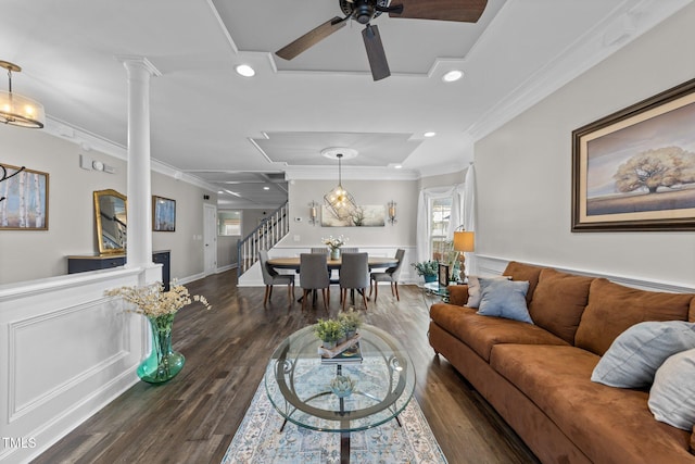 living room with stairs, decorative columns, ornamental molding, recessed lighting, and wood finished floors