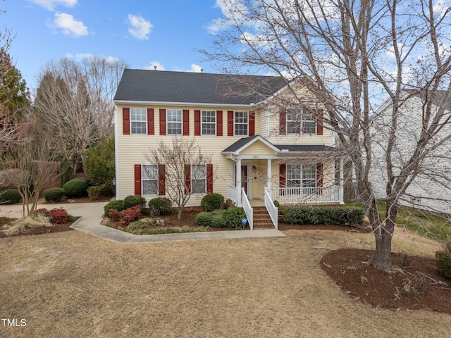 colonial home featuring a porch