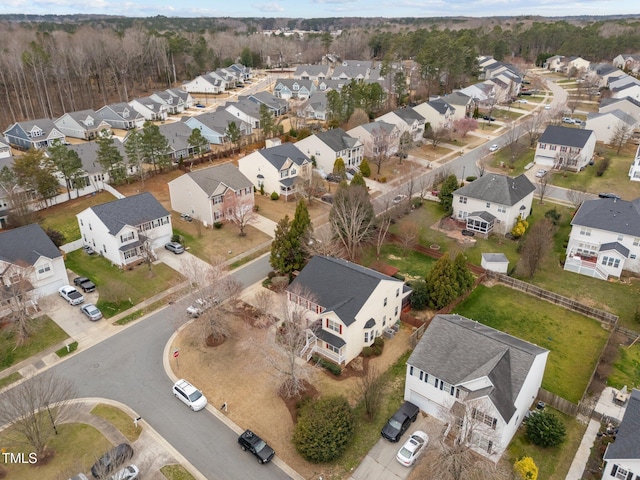 birds eye view of property with a residential view