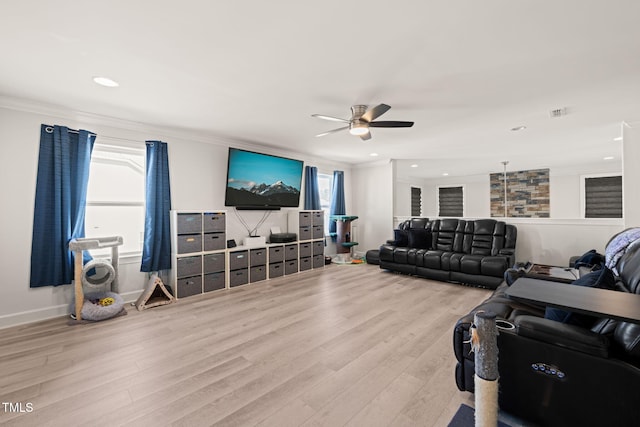 living room with baseboards, a ceiling fan, wood finished floors, crown molding, and recessed lighting