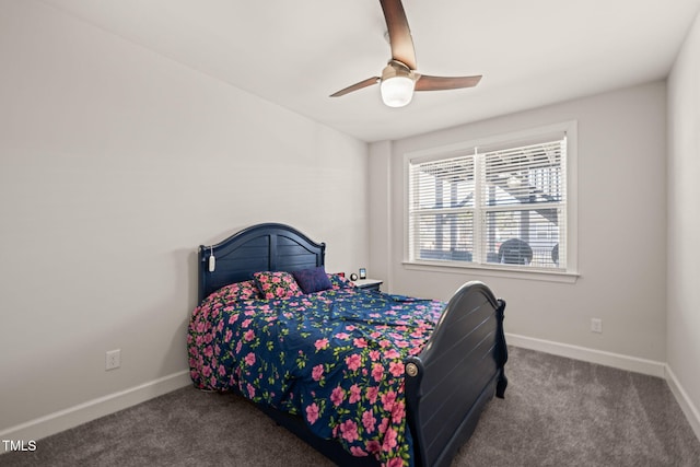 carpeted bedroom with a ceiling fan and baseboards