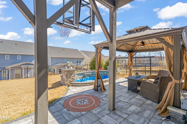 view of patio / terrace featuring a fenced backyard, a fenced in pool, and a gazebo