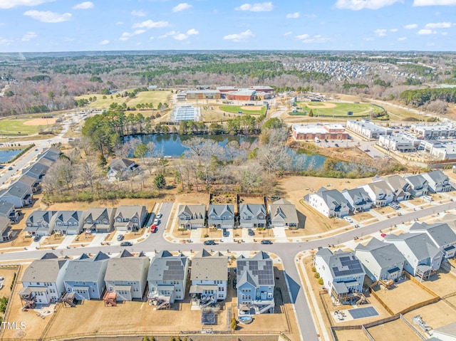 drone / aerial view with a water view and a residential view