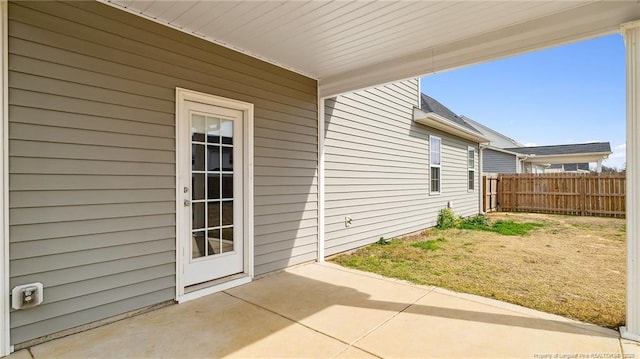 exterior space featuring a patio area and fence