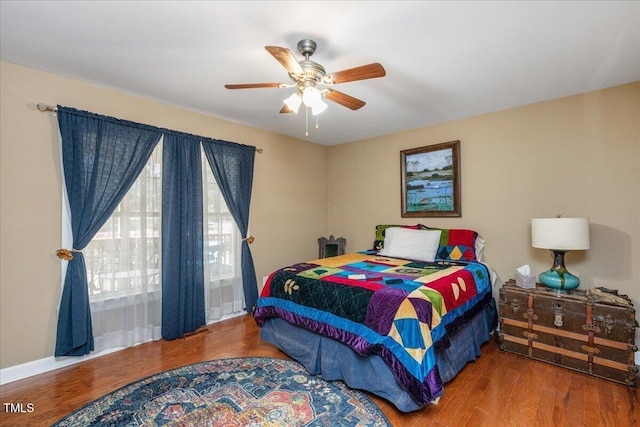 bedroom with ceiling fan and wood finished floors