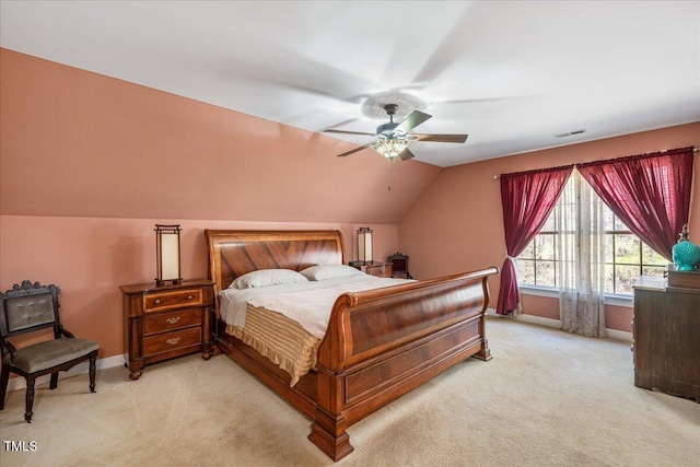 bedroom featuring lofted ceiling, light carpet, ceiling fan, and baseboards