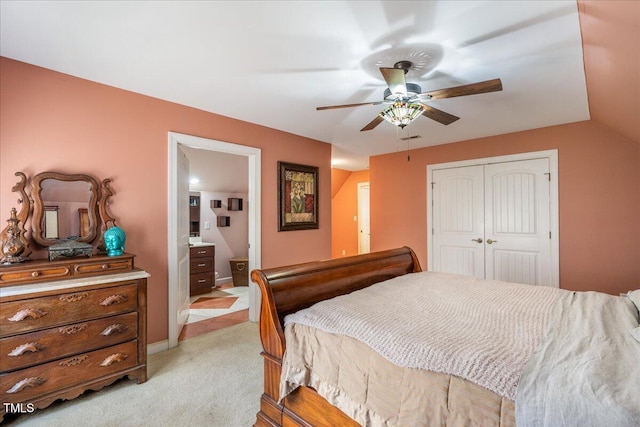 bedroom featuring a closet, visible vents, light carpet, ceiling fan, and baseboards