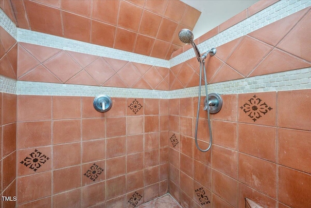 full bathroom with a tile shower