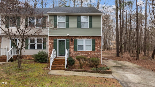 view of property with brick siding