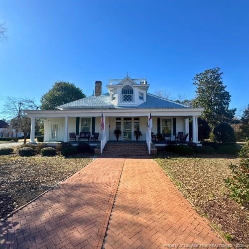 farmhouse with a porch