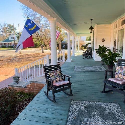 wooden terrace featuring a porch