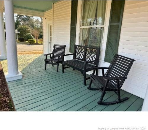 wooden terrace with covered porch