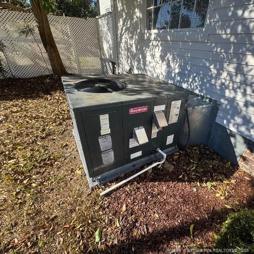 details with central air condition unit and fence