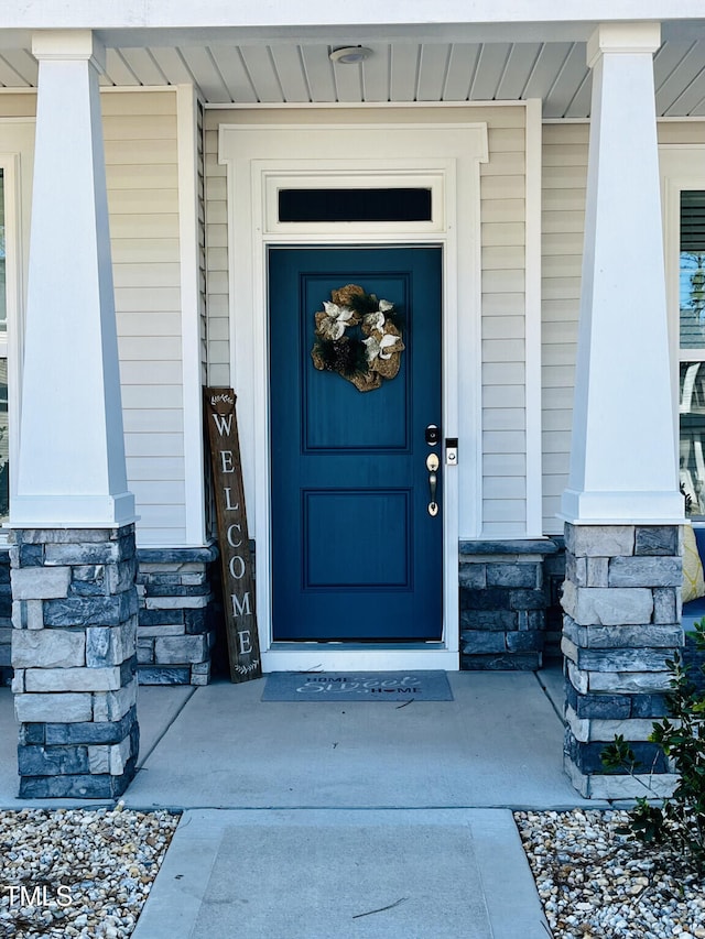 view of exterior entry with stone siding