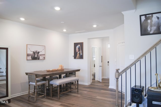 dining space with baseboards, dark wood finished floors, recessed lighting, ornamental molding, and stairs