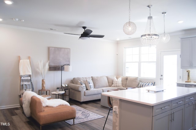 living area with visible vents, ceiling fan, ornamental molding, recessed lighting, and dark wood-style flooring