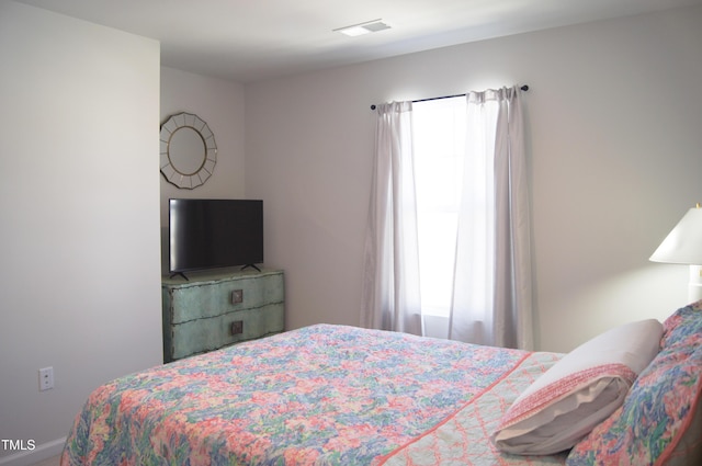 bedroom featuring visible vents