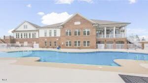 outdoor pool featuring a patio