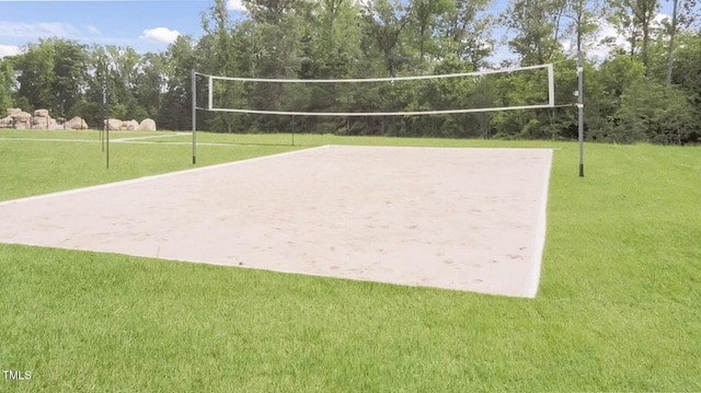 view of community featuring a lawn and volleyball court