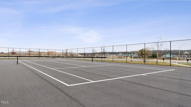 view of sport court with fence