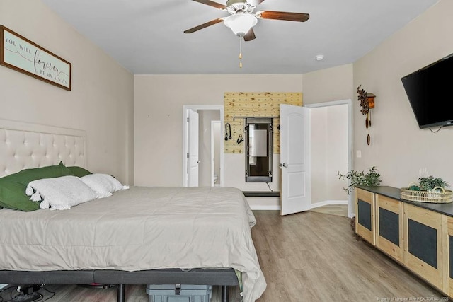 bedroom featuring ceiling fan and wood finished floors