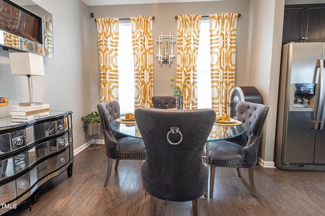 dining space with a healthy amount of sunlight, dark wood finished floors, and baseboards