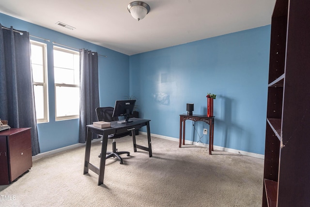 home office with carpet, visible vents, and baseboards