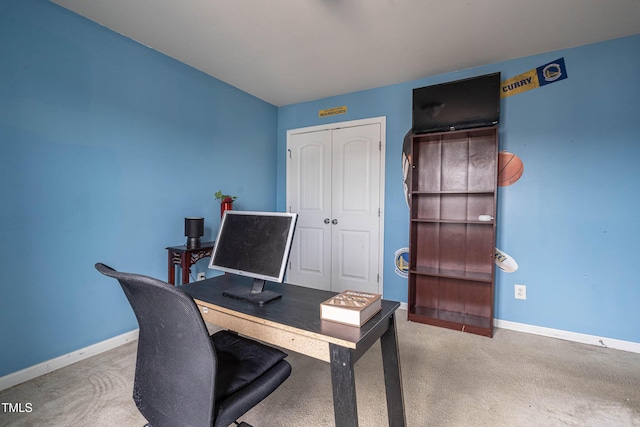 office space featuring baseboards and carpet flooring