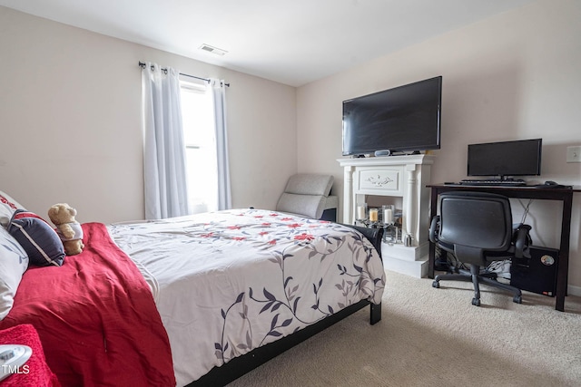 bedroom featuring carpet and visible vents