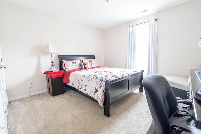 bedroom featuring carpet floors, baseboards, and visible vents