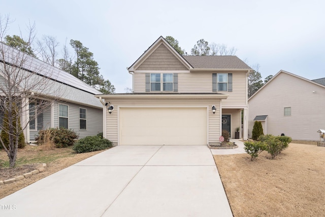 view of front of home with driveway and an attached garage