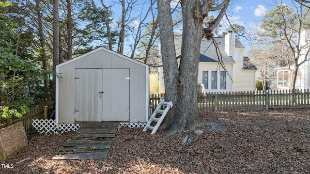 view of shed with fence private yard