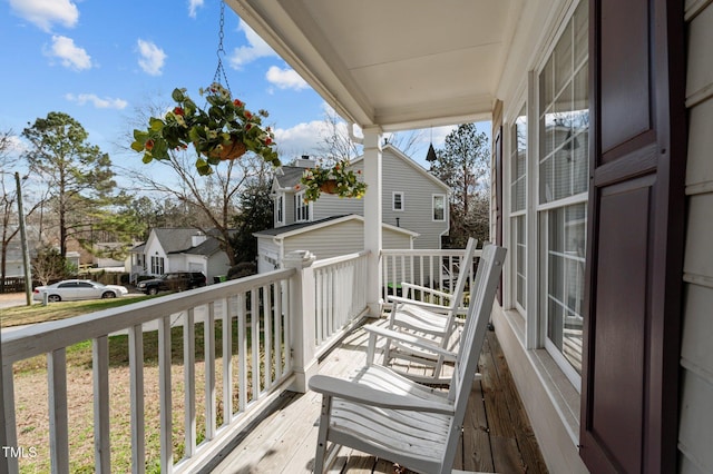 balcony with a porch and a residential view