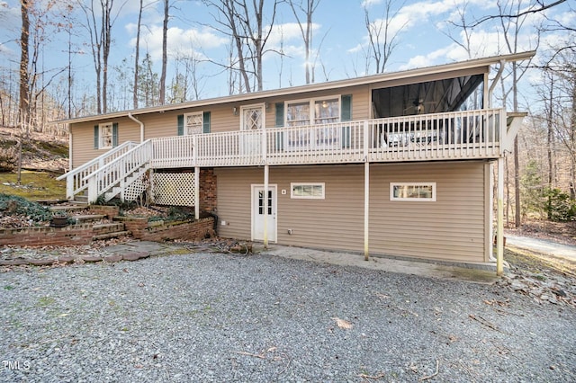 view of front of home with driveway and stairway