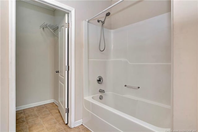 full bath with tub / shower combination and baseboards