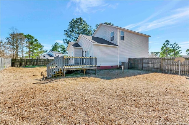 back of property featuring crawl space, a fenced backyard, a deck, and central air condition unit